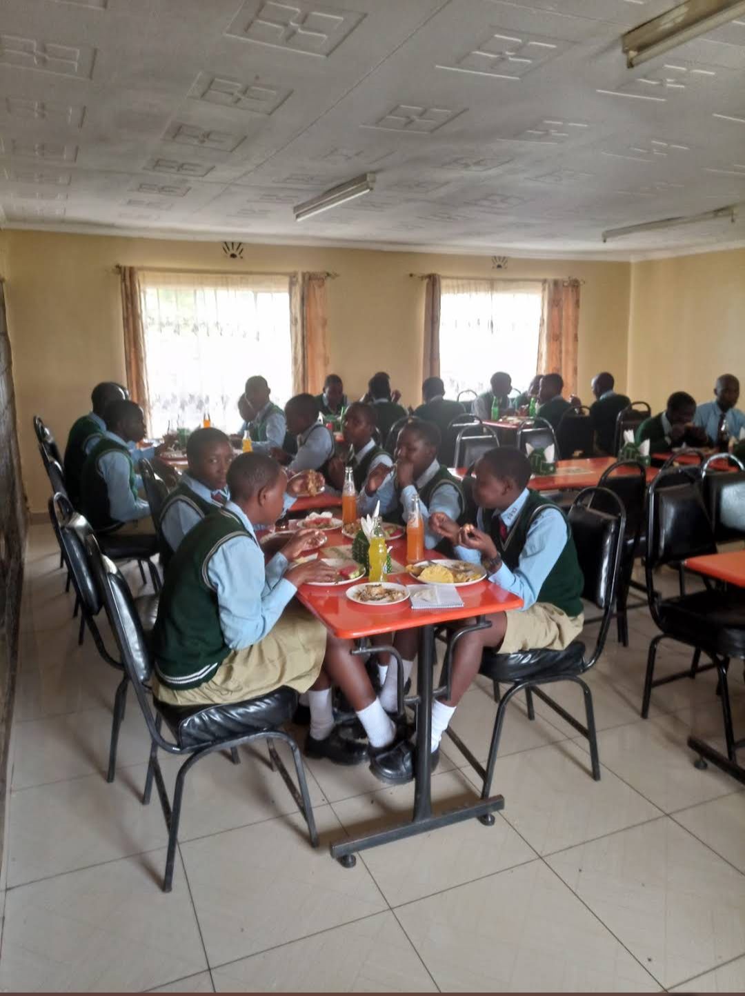 A school group enjoying a meal in the dining hall