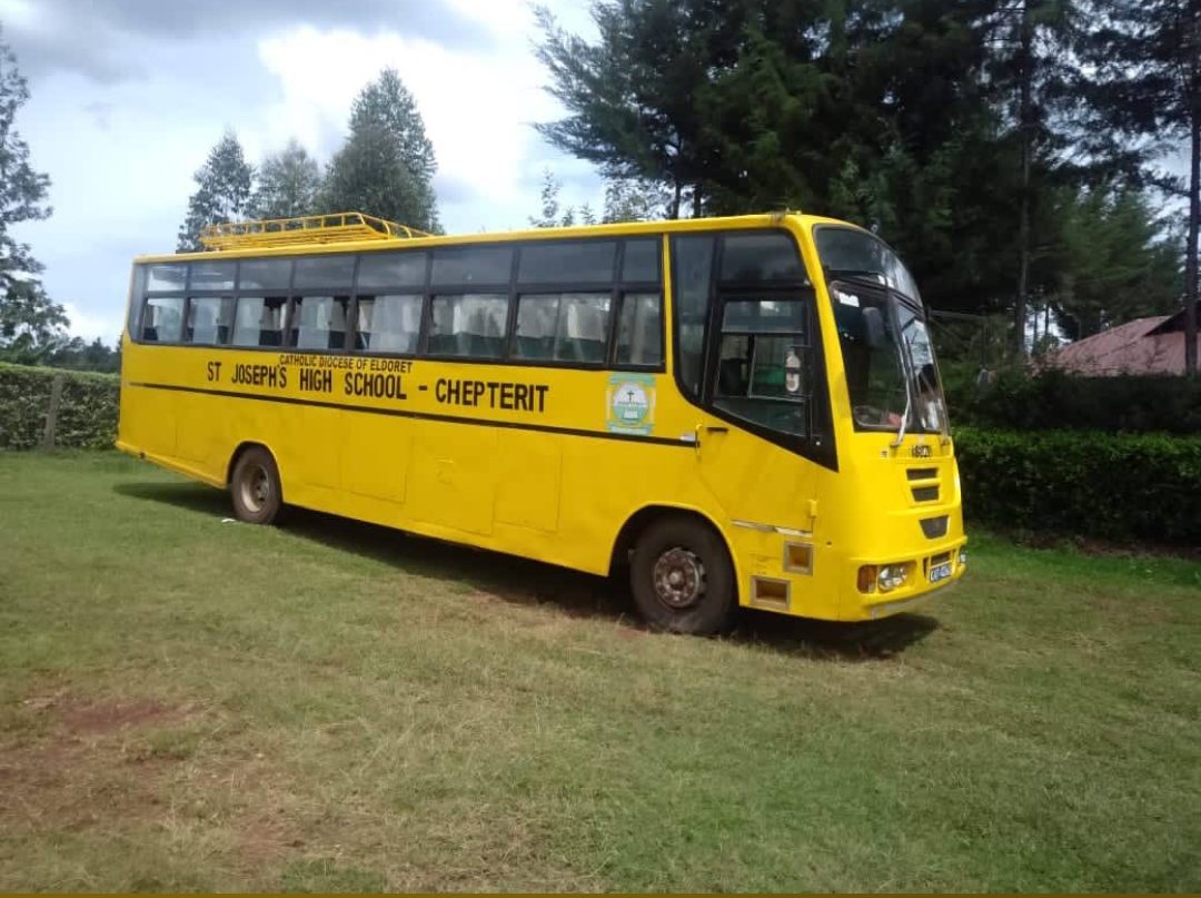 A visiting school bus parked on the grounds