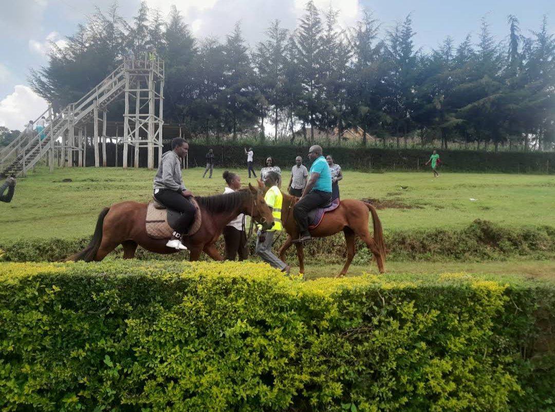 Guests horse-riding on the grounds during a team-building day
